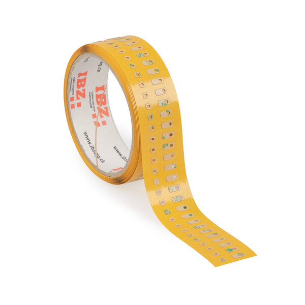 Die Abbildung zeigt selbstklebende Formstanzteile, die in Kleinstteile im 2er-Set gestanzt wurden. Der Liner ist gelb, der Hintergrund ist weiss.