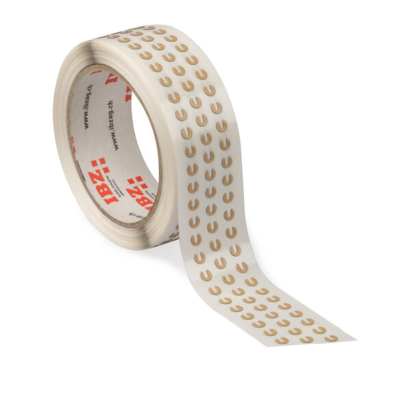 Die Abbildung zeigt selbstklebende Formstanzteile, die in Kleinstteilen in Hufeisenform gestantz wurden. Der Linerd ist durchsichtig, der Hintergrund ist weiss.