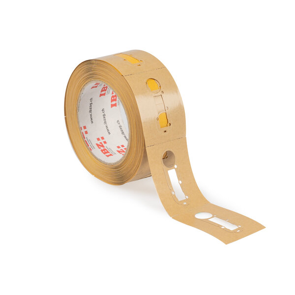 Die Abbildung zeigt selbstklebende Formstanzteile mit komplexen Konturen und Perforation. Der Liner ist braun, der Hintergrund ist weiss.